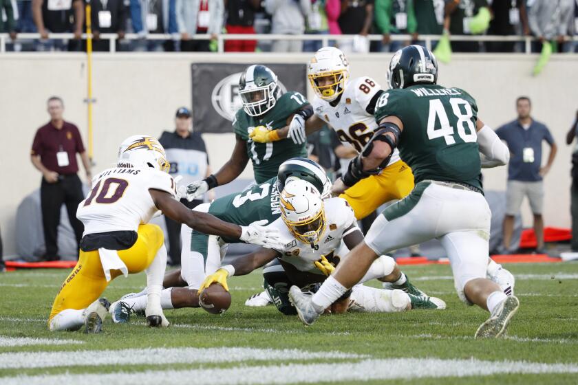 EAST LANSING, MI - SEPTEMBER 14: Eno Benjamin #3 of the Arizona State Sun Devils stretches the ball over the goal line for a touchdown in the fourth quarter of the game against the Michigan State Spartans at Spartan Stadium on September 14, 2019 in East Lansing, Michigan. Arizona State defeated Michigan State 10-7. (Photo by Joe Robbins/Getty Images)