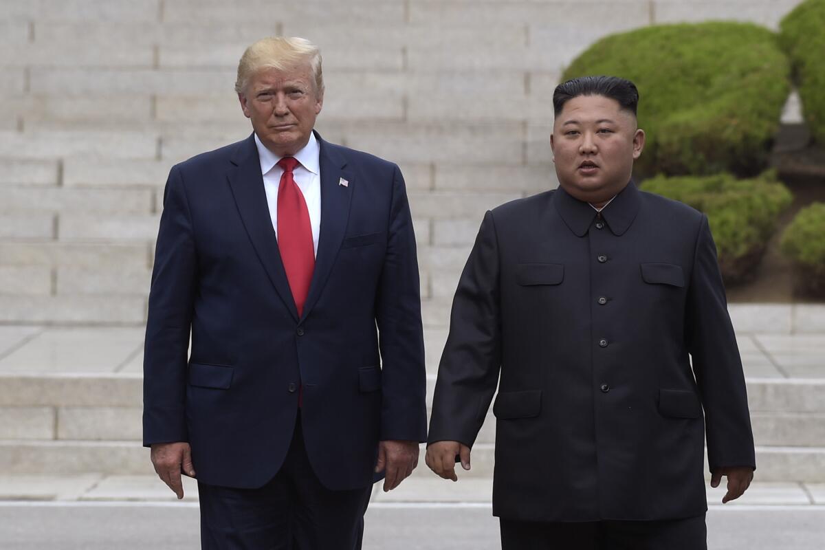 President Trump, left, meets with North Korean leader Kim Jong Un at the North Korean side of the border at the village of Panmunjom in the Demilitarized Zone on June 30, 2019.