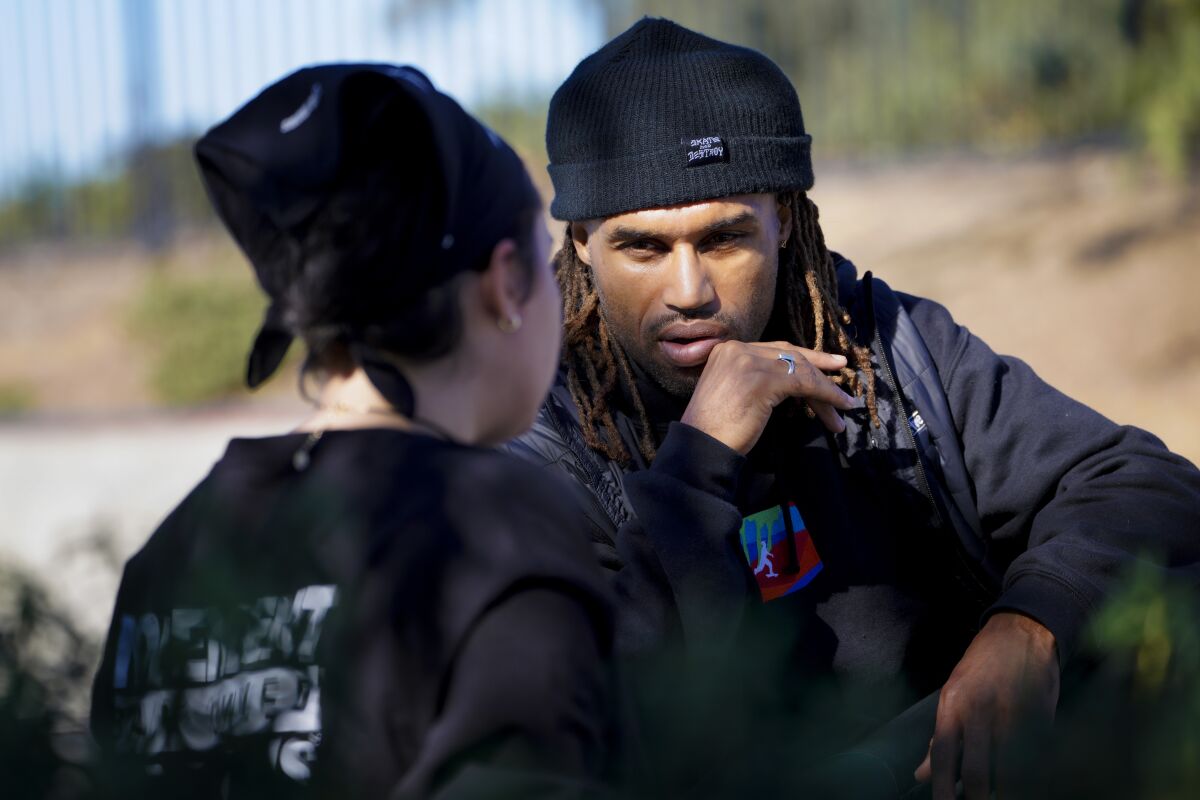 Brandon Turner chats with Vivian Gunther at the Linda Vista Skate Park on Dec. 15.
