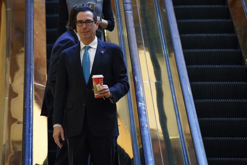 Treasury Secretary-designate Steven Mnuchin rides the elevator at Trump Tower in New York last month.