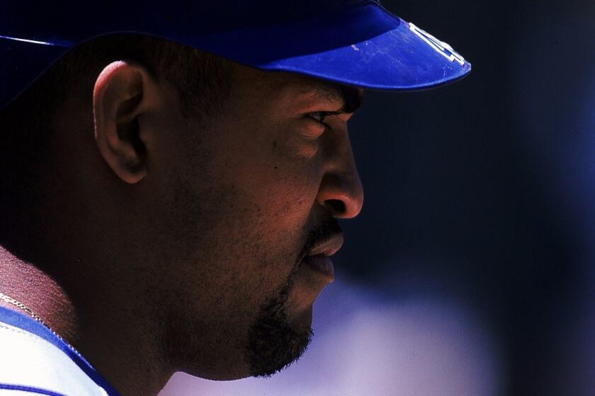 13 Jun 1999: A close up of Raul Mondesi 43 of the Los Angelas Dodgers as he looks on during the game against the Oakland Athletics at the Oakland Coliseum in Oakland, California. The Athletics defeated the Dodgers 95.