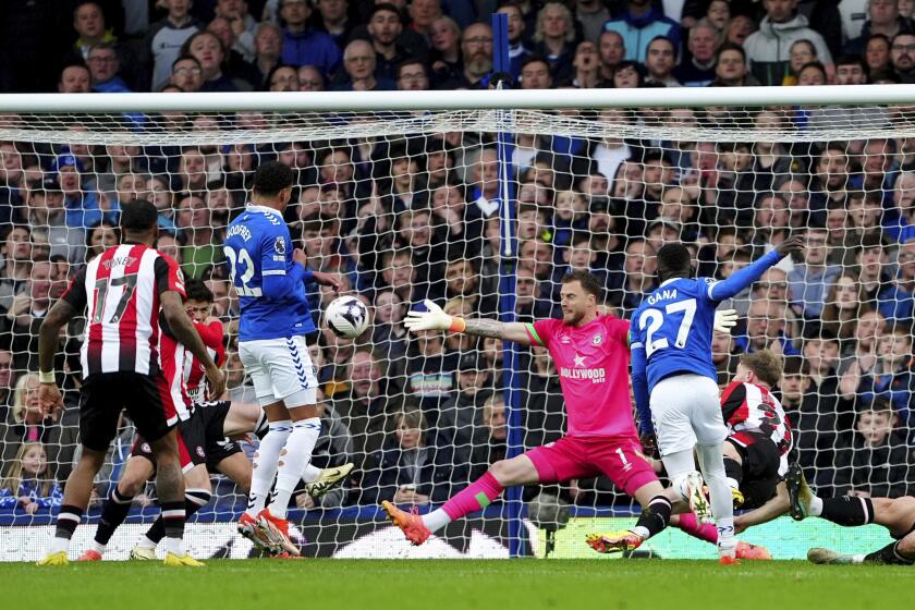 Everton's Idrissa Gueye, front right, scores his sides first goal during the English Premier League soccer match between FC Everton and FC Brentford in Liverpool, England, Saturday, April 27, 2024. (Peter Byrne/PA via AP)