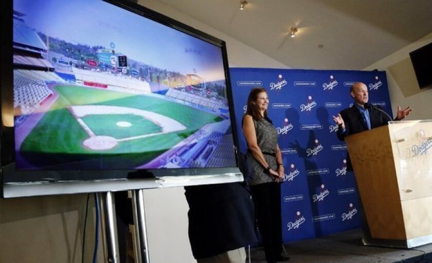 Stan Kasten, president and CEO of the Dodgers, right, and Janet Marie Smith, senior vice president of planning and development, speak about improvements to Dodger Stadium on Jan. 8.