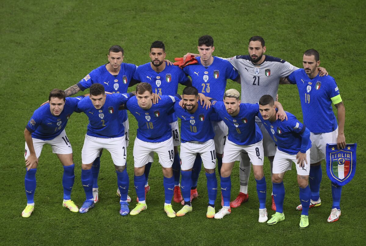 Italian players pose before the UEFA Nations League semifinal soccer match between Italy and Spain at the San Siro stadium, in Milan, Italy, Wednesday, Oct. 6, 2021. (Marco Bertorello/Pool via AP)