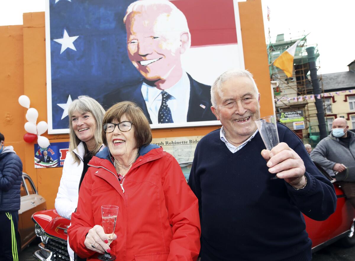 Brendan Blewitt, a cousin of Joe Biden, and his sister Breege Bourke celebrate Saturday in Ballina, Ireland.