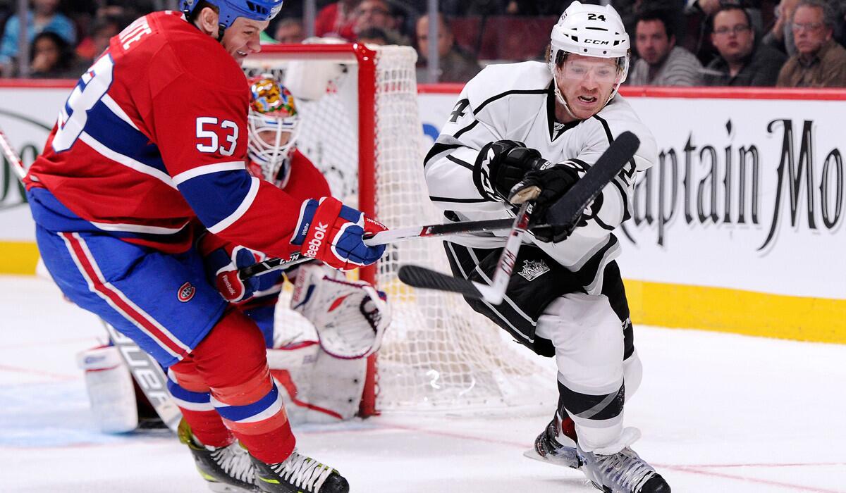 Kings forward Colin Fraser makes a pass against Montreal's Ryan White during a game last season.