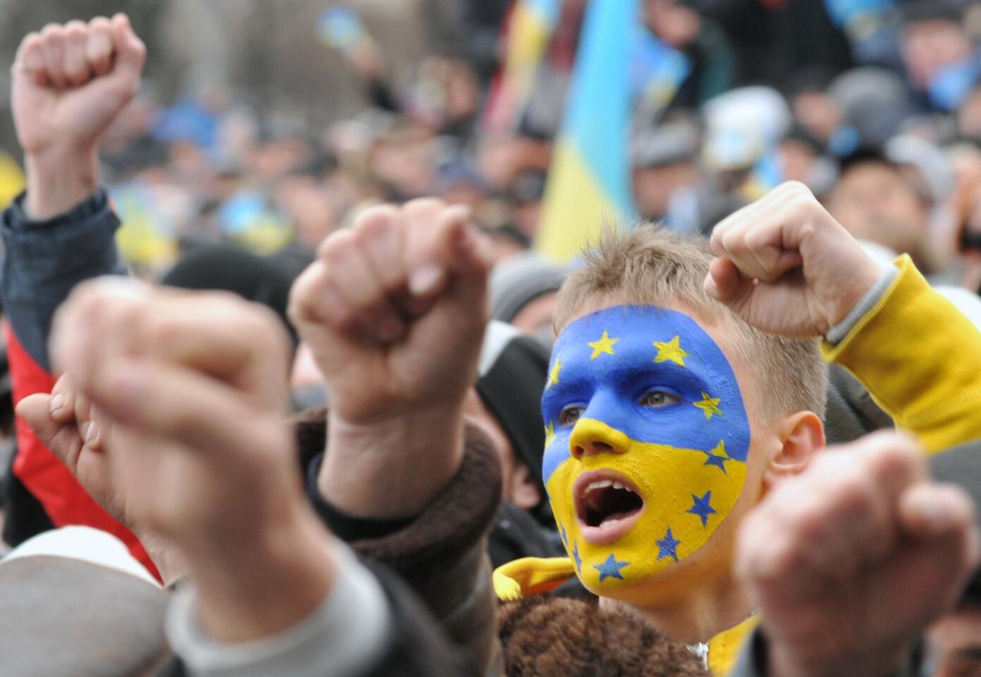 Protesters shout slogans during an opposition rally in Lviv, Ukraine.