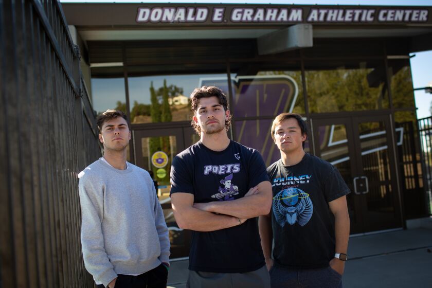 WHITTIER, CA - NOVEMBER 23: Former lacrosse captain Alex Coco (center) along with fellow teammates Noah Tobias (right) and Kale Lanza (left) gather outside Graham Athletics Center at Whittier College on Wednesday, Nov. 23, 2022 in Whittier, CA. Whittier College announced earlier this month it would end its football, lacrosse and golf programs. (Jason Armond / Los Angeles Times)