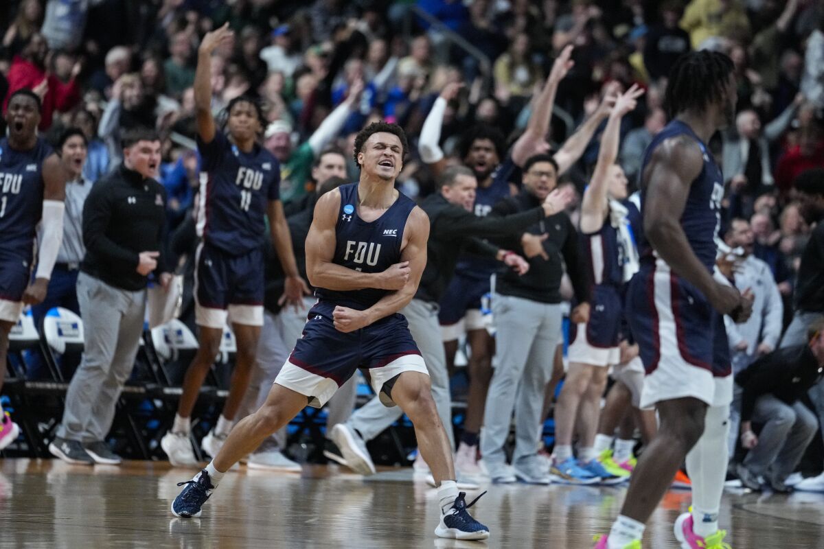 Fairleigh Dickinson guard Grant Singleton celebrates after a basket against Purdue.