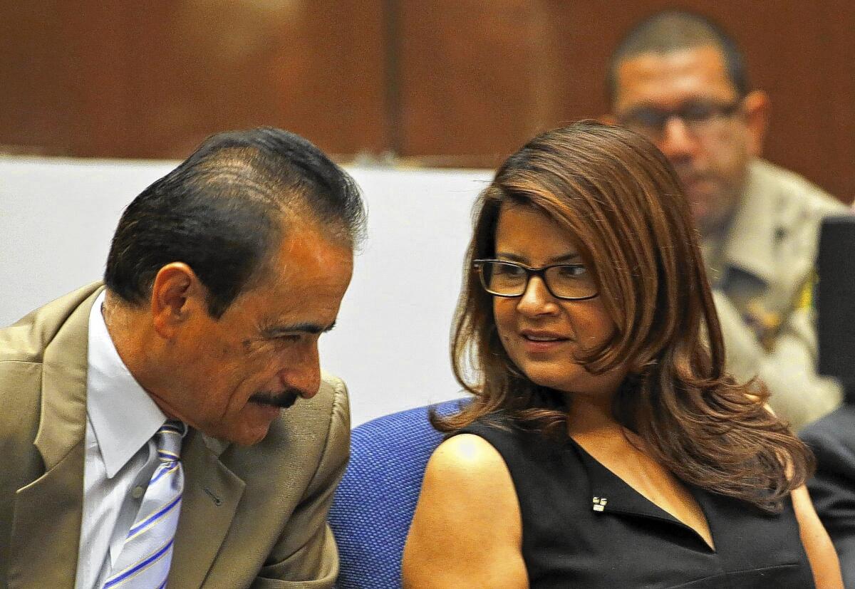 Former L.A. City Councilman Richard Alarcon and his wife, Flora Montes de Oca Alarcon, confer during their trial for perjury and voter fraud. The prosecution called its last witnesses on Friday.