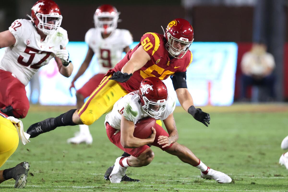 USC's Nick Figueroa sacks Washington State quarterback Jayden de Laura.