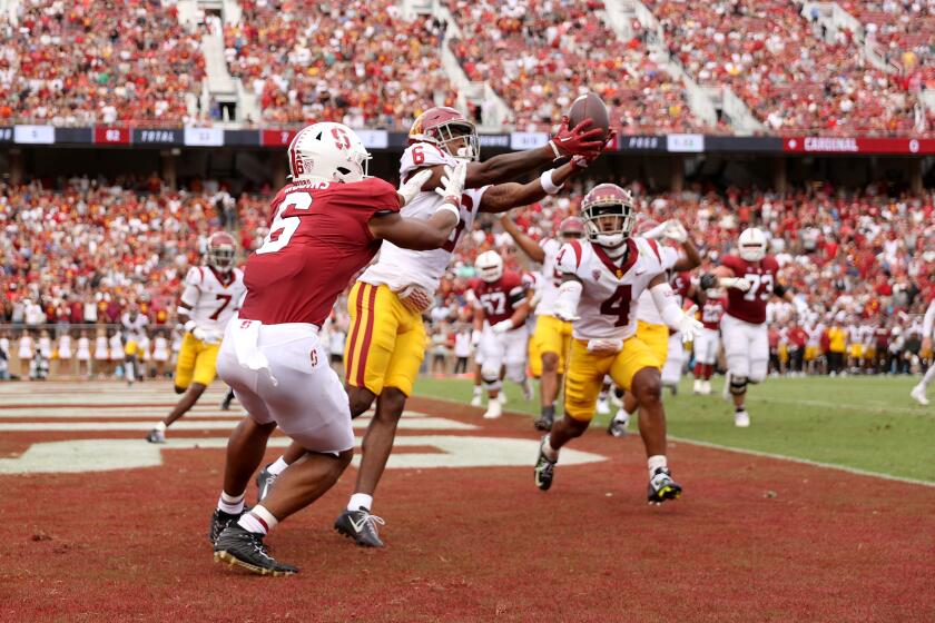 STANFORD, CALIFORNIA - SEPTEMBER 10: Mekhi Blackmon #6 of the USC Trojans intercepts a pass intended for Elijah Higgins #6 of the Stanford Cardinal in the end zone during the first half at Stanford Stadium on September 10, 2022 in Stanford, California. (Photo by Ezra Shaw/Getty Images)