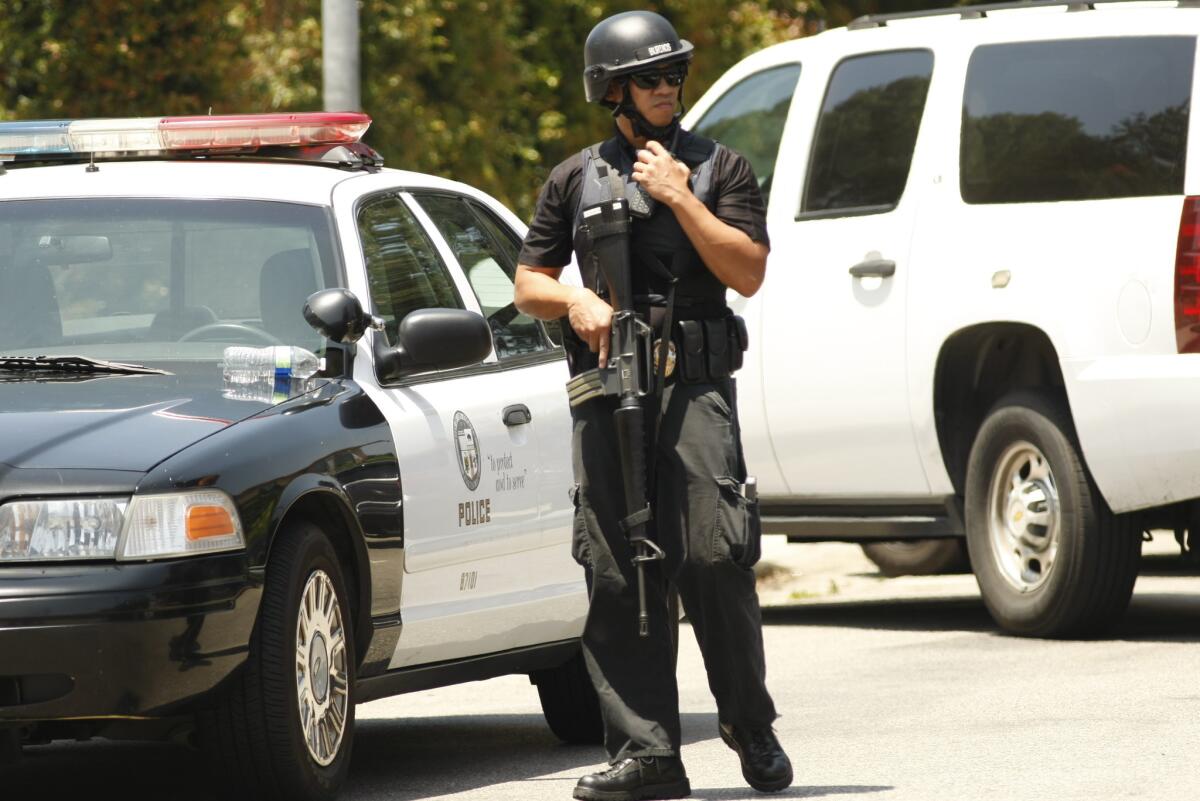 LAPD lock down a North Hollywood neighborhood after a man with a rifle was spotted in the area.