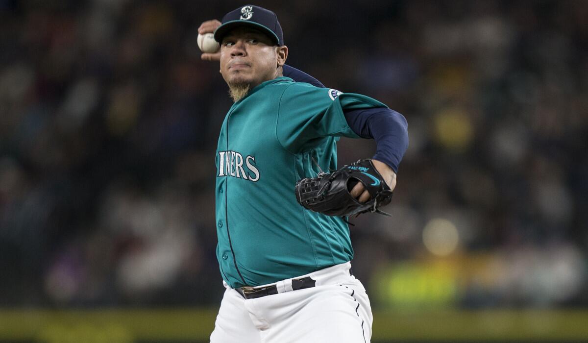 Seattle Mariners pitcher Felix Hernandez delivers a pitch during the sixth inning against the Minnesota Twins on Friday.