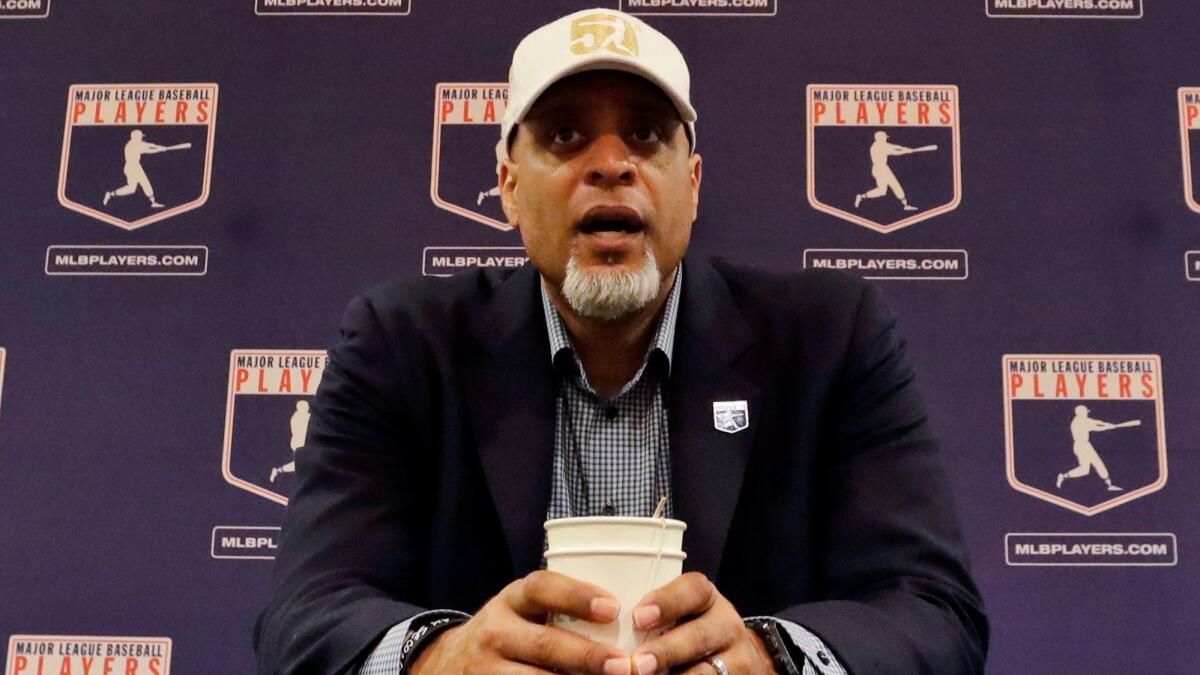 Tony Clark, executive director of the Major League Players Association, answers questions at a news conference in Phoenix on Feb. 19, 2017.