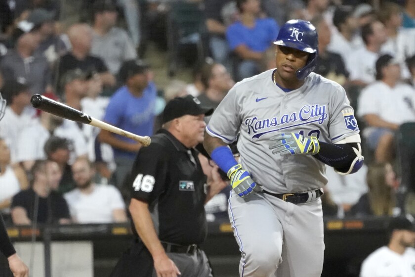 Kansas City Royals' Salvador Perez tosses his bat after hitting a two-run home run off Chicago White Sox starting pitcher Lucas Giolito during the third inning of a baseball game Wednesday, Aug. 4, 2021, in Chicago. Carlos Santana also scored on the play. (AP Photo/Charles Rex Arbogast)