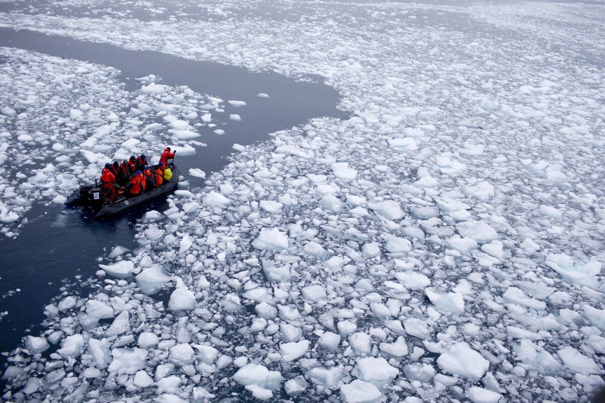 A Zodiac carrying a team of international scientists heads to Chile's station Bernardo O'Higgins, Antarctica in January. Western Antarctica's sea-based ice shelves, which buttress land ice, have begun melting 70% faster in the decade, a new study suggests.