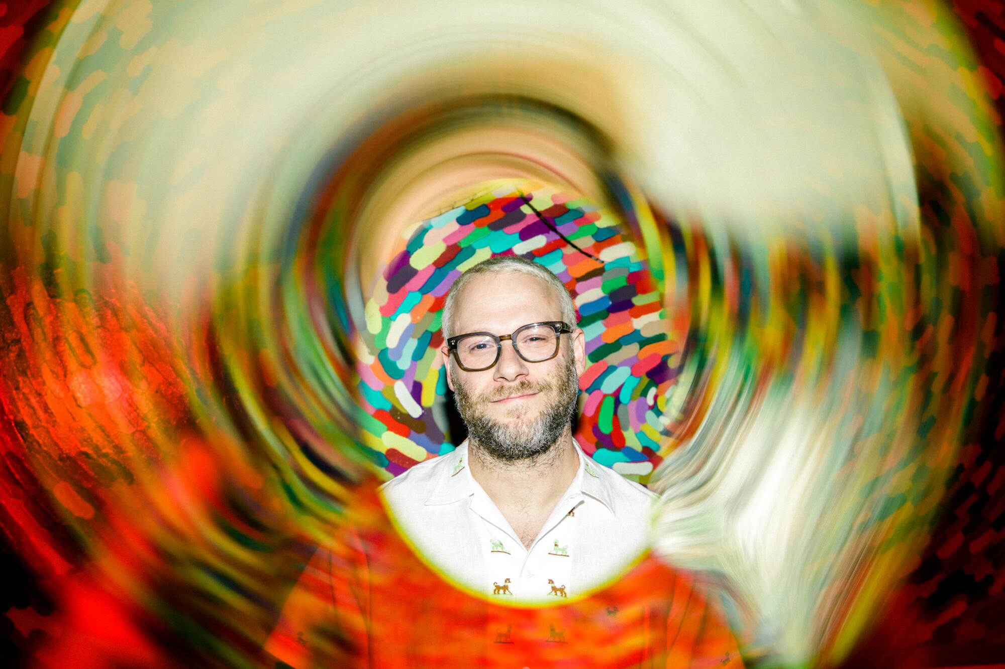 A multicolored, psychedelic portrait of actor-writer-producer Seth Rogen