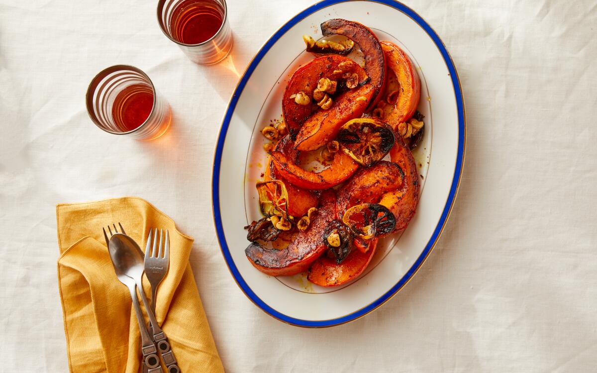 Chile-spiced hazelnuts and turmeric add piquancy to hearty winter squash roasted with sweet dates and lemon slices.