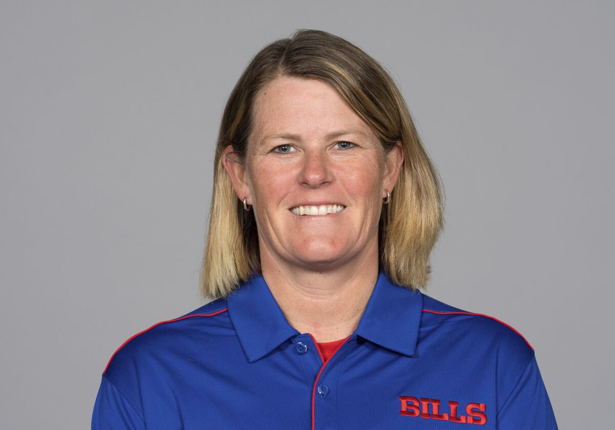FILE - Laura Young poses for a photo in 2019, when Young was on the staff of the Buffalo Bills NFL football team. New York Giants coach Brian Daboll filled out a majority of his staff Friday, Feb. 11, 2022, hiring the first woman to hold a coaching position in the team’s history along with a pair of coordinators new to New York. Among those announced to join the recently hired Daboll was Young, who will be the team’s director of coaching operations, coordinating and organizing practices, as well as game-day operations. (AP Photo, File)