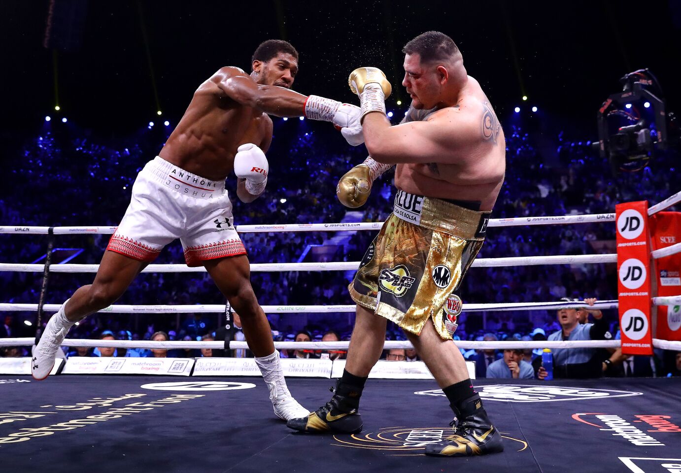 Anthony Joshua hits Andy Ruiz Jr. with a right hand during their heavyweight title fight on Dec. 7 in Diriyah, Saudi Arabia.