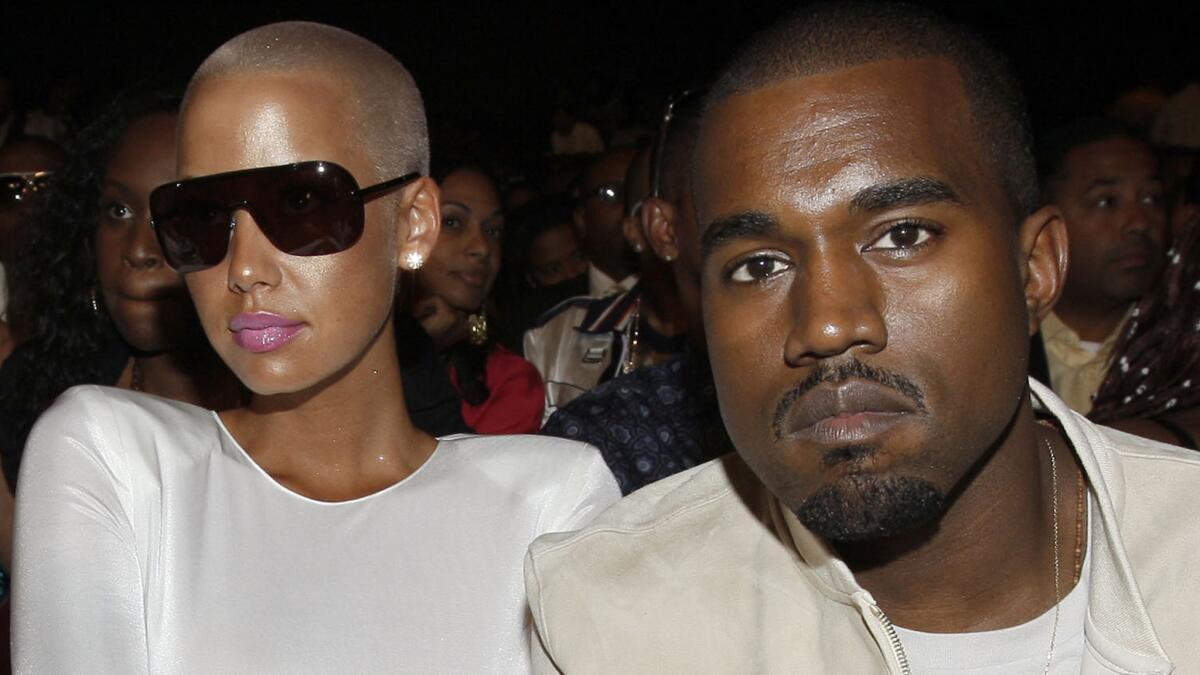 Amber Rose and Kanye West in "happier times" at the BET Awards in June 2009. On Friday, he lobbed some bombs in her direction in response to shots she'd taken at his in-laws a week ago.