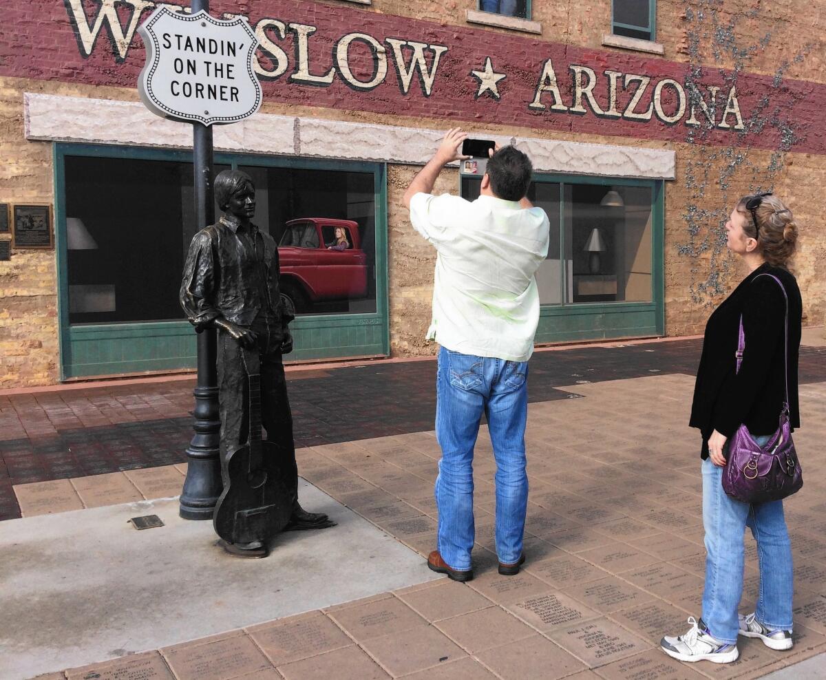 An estimated 100,000 people each year visit this corner in Winslow, Arizona, at the intersection of 2nd and Kinsley streets. The statue was added in 1999, helping revive the old Route 66 town.