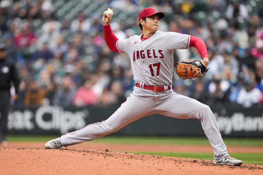 Los Angeles Angels starting pitcher Shohei Ohtani throws against the Seattle Mariners during the second inning of a baseball game Wednesday, April 5, 2023, in Seattle. (AP Photo/Lindsey Wasson)