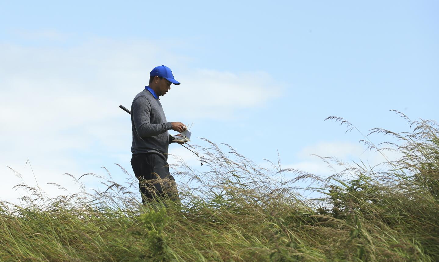 Tiger Woods walks toward the third tee during the first round of the 148th Open Championship at Royal Portrush Golf Club in Northern Ireland.