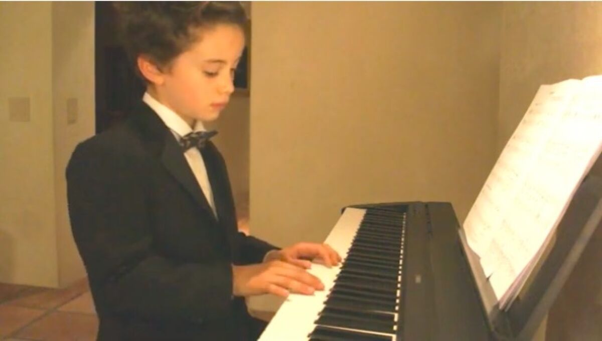 R. Roger Rowe kindergartner James Burnell performs in the virtual talent show.