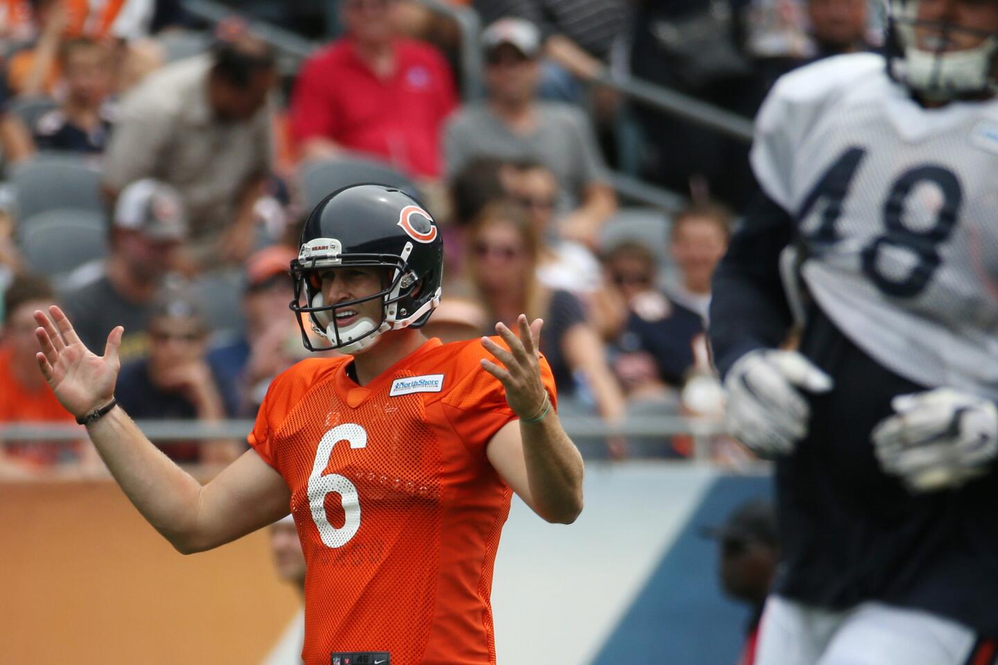 Bears quarterback Jay Cutler gestures to his teammates after he was unable to complete a pass.