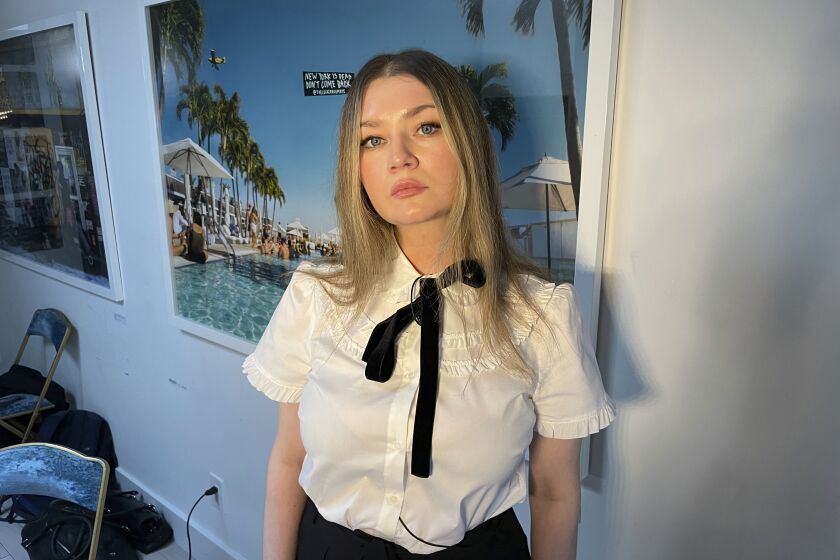 Anna Delvey, also known as Anna Sorokin, poses at her apartment in New York on May 26, 2023, to promote her podcast, “The Anna Delvey Show.” (AP Photo/John Carucci)