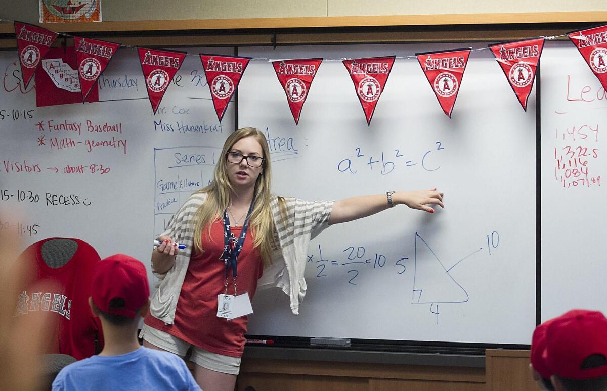 Teacher Natalie Hanenkrat explains the Pythagorean theorem to her students enrolled in the Angels Science of Baseball class Thursday at Stonegate Elementary School in Irvine.