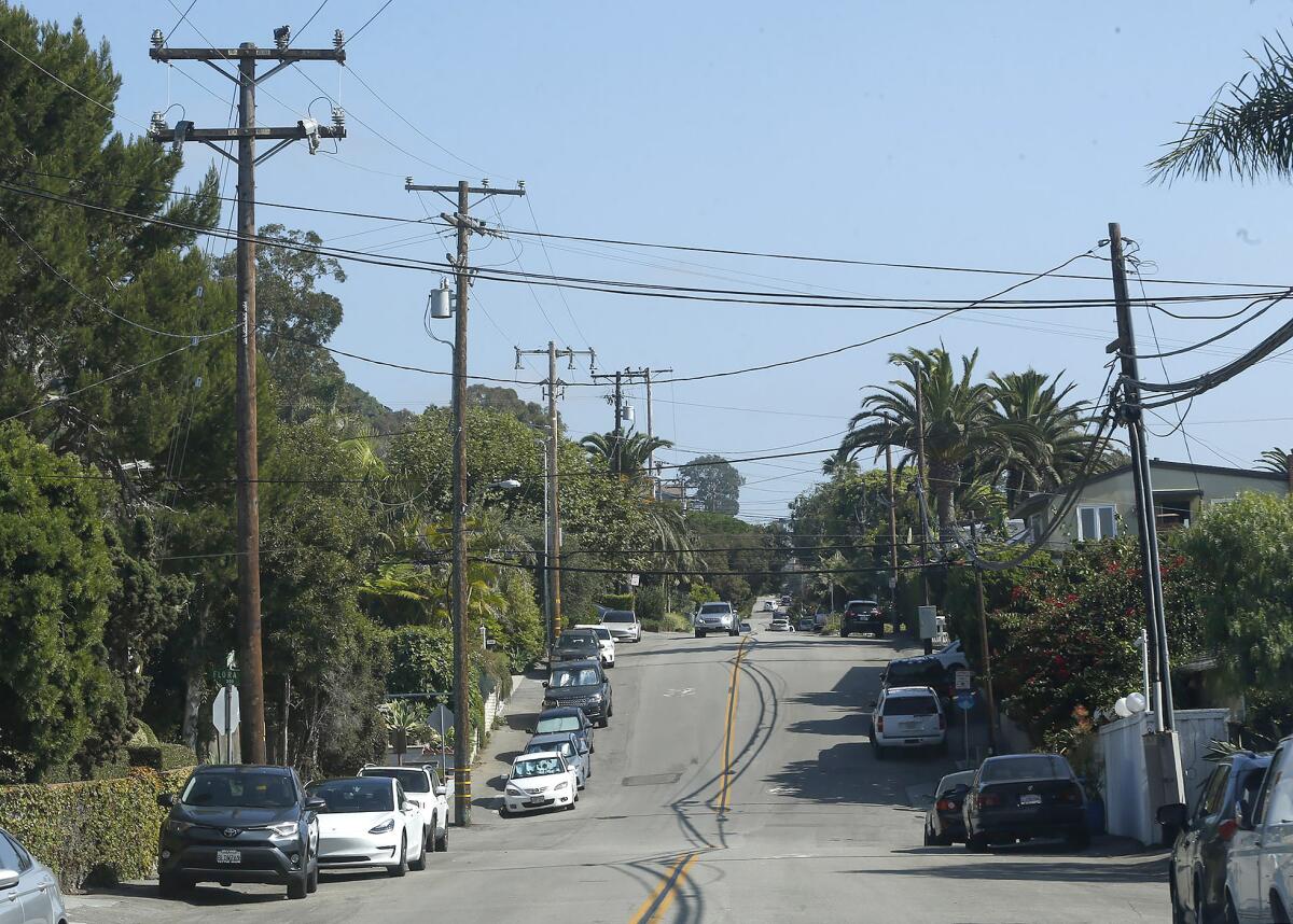 Power poles line Glenneyre Street in the neighborhood of Woods Cove in Laguna Beach.