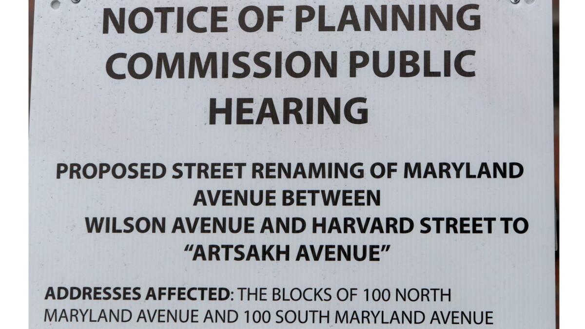 A sign posted at the corner of N. Maryland and Wilson avenues advises of the proposed street renaming.