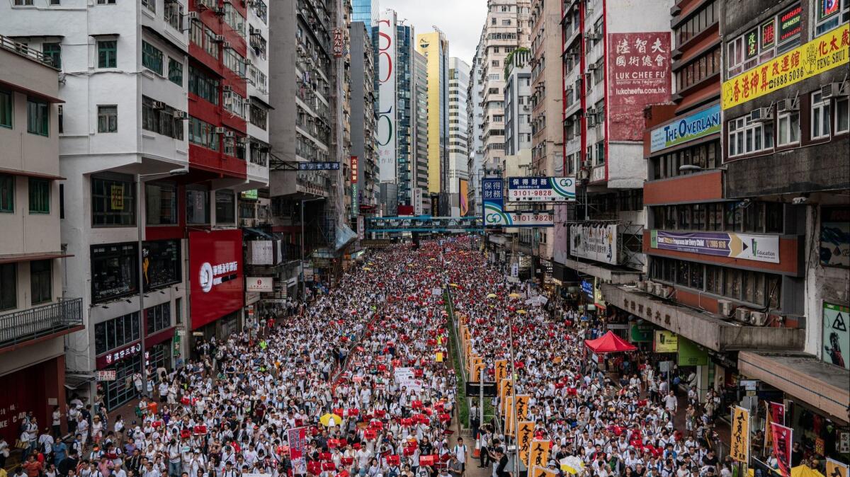 Protesters march in Hong Kong against a controversial extradition bill that would allow suspected criminals to be sent to mainland China for trial.