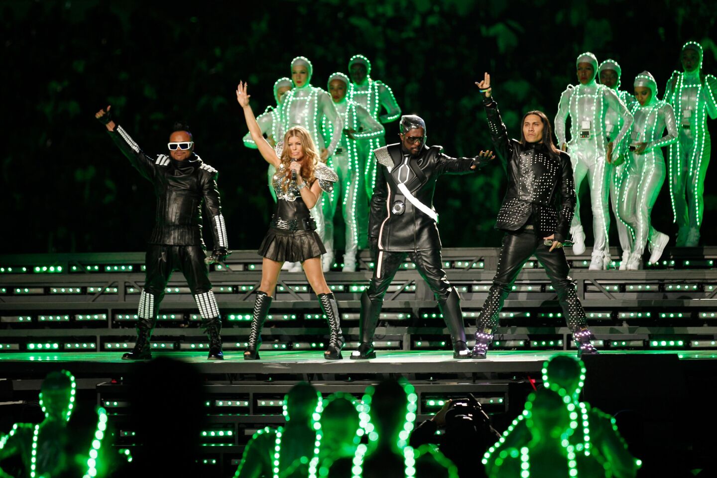 The Black Eyed Peas largely stayed still during the performance, letting the backup dancers in "Tron"-like get-ups provide the eye candy, yet they still infused their hits with energy. The result was a success -- their tuneful chants seemed built for the stadium.