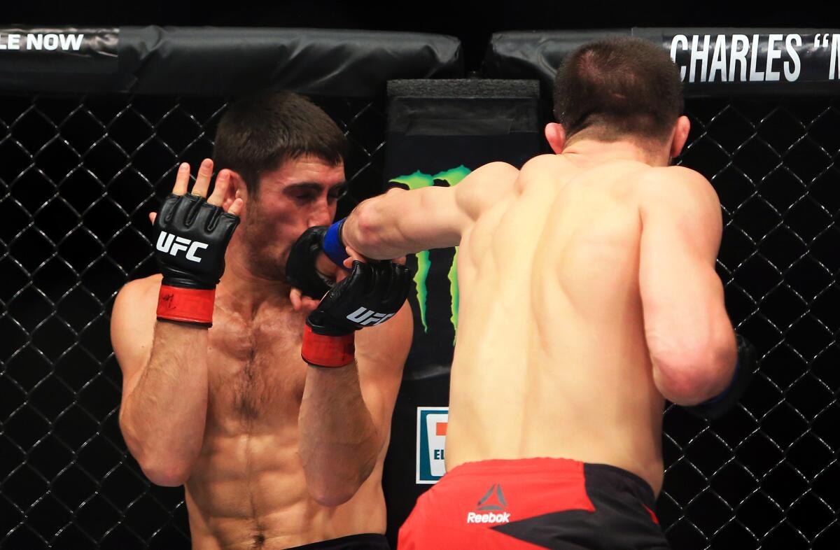 Rustam Khabilov lands a punch against Jason Saggo during their bout at UFC 206.