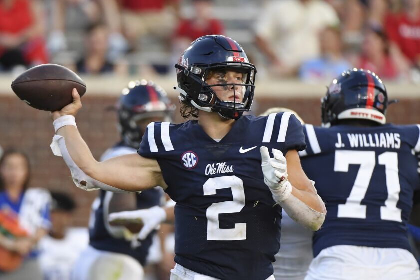 Mississippi quarterback Jaxson Dart (2) looks to pass during the second half of an NCAA college football game against Tulsa in Oxford, Miss., Saturday, Sept. 24, 2022. Mississippi won 35-27. (AP Photo/Thomas Graning)