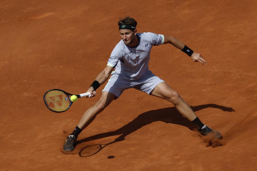 Casper Ruud of Norway returns the ball against Tomas Martin Etcheverry of Argentina during a semi final open tennis tournament in Barcelona, Spain, Saturday, April 20, 2024. (AP Photo/Joan Monfort)