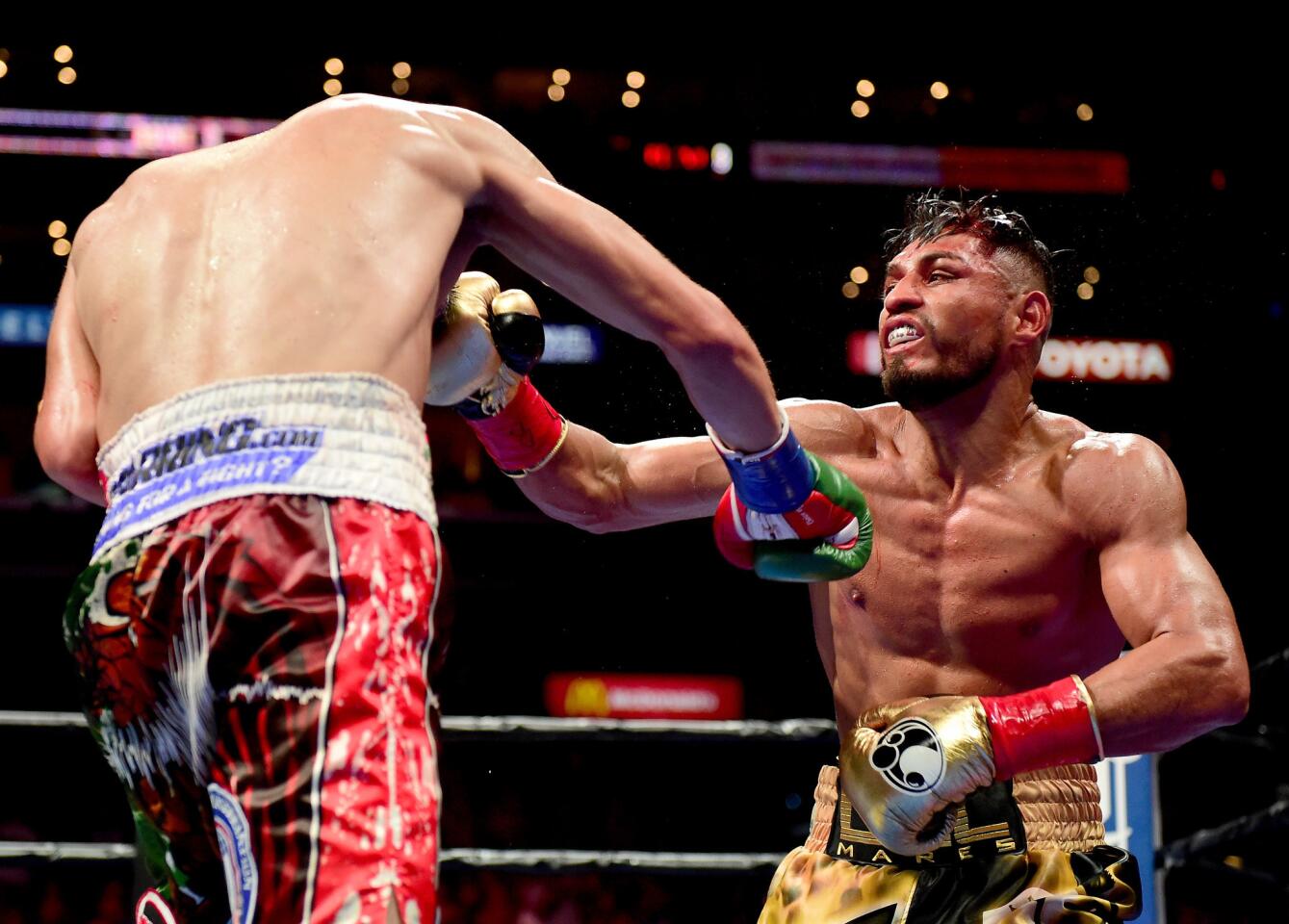 LOS ANGELES, CA - AUGUST 29: Leo Santa Cruz punches Abner Mares of Mexico during the ninth round of the WBC diamond featherweight and WBA featherweight championship bout at Staples Center on August 29, 2015 in Los Angeles, California. Santa Cruz would win in a 12 round decision. (Photo by Harry How/Getty Images) ** OUTS - ELSENT, FPG - OUTS * NM, PH, VA if sourced by CT, LA or MoD **