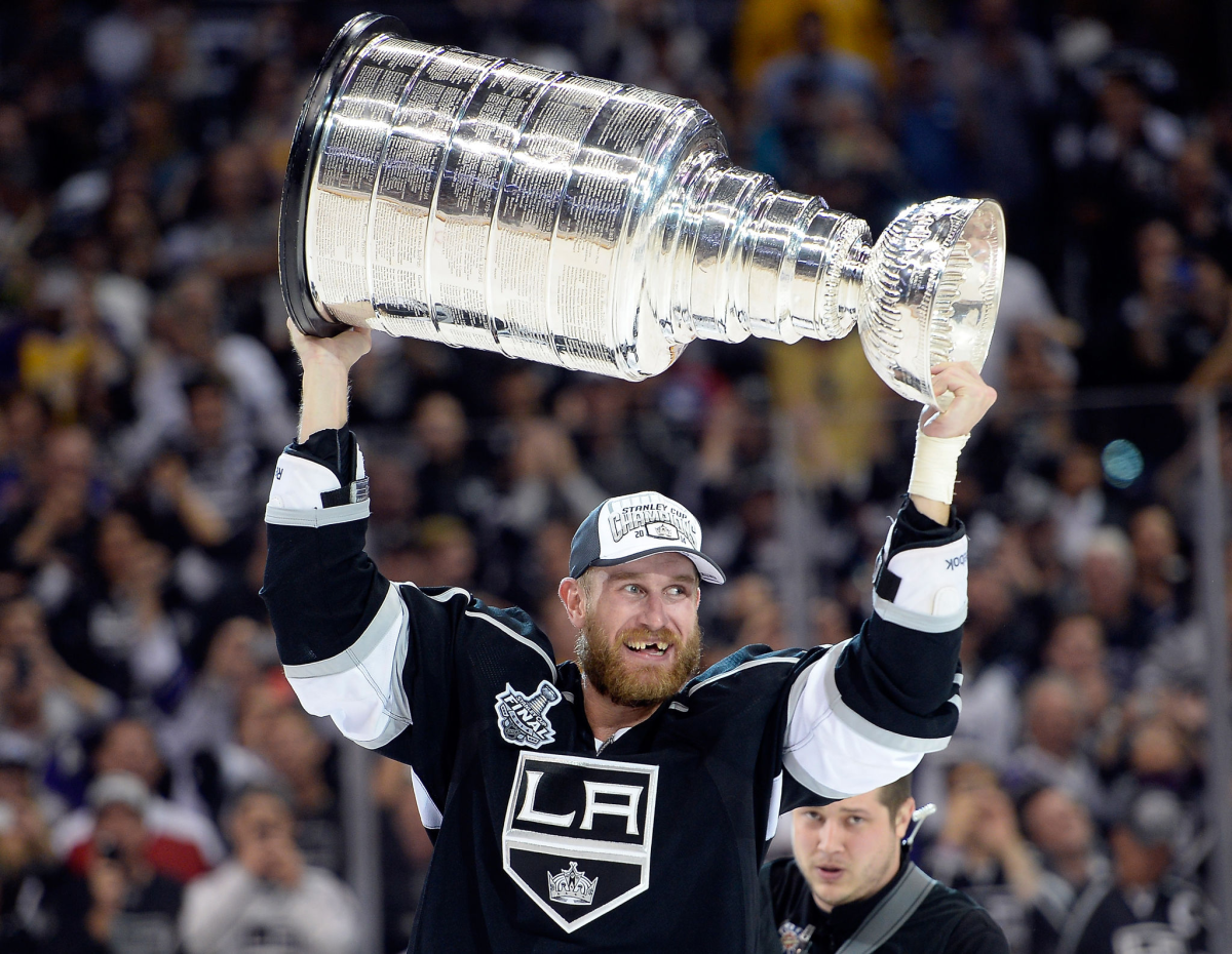 Jeff Carter carries the Stanley Cup after the Kings victory over the New York Rangers.