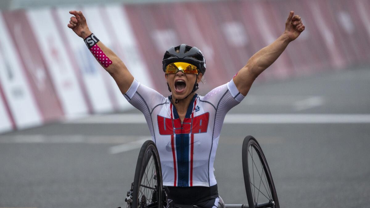 U.S. paracylist Oksana Masters celebrates after winning gold at the Tokyo Paralympics.