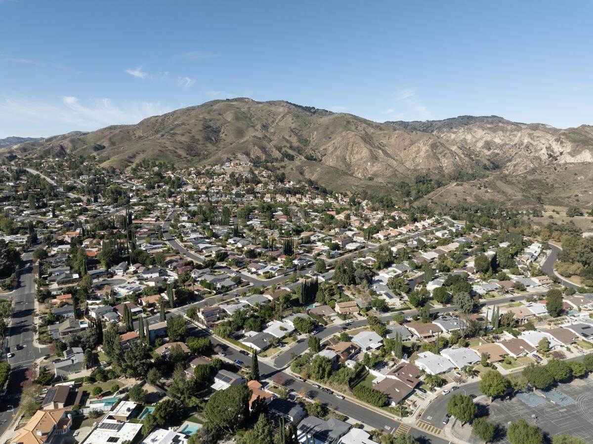 Hills rise behind a residential neighborhood.