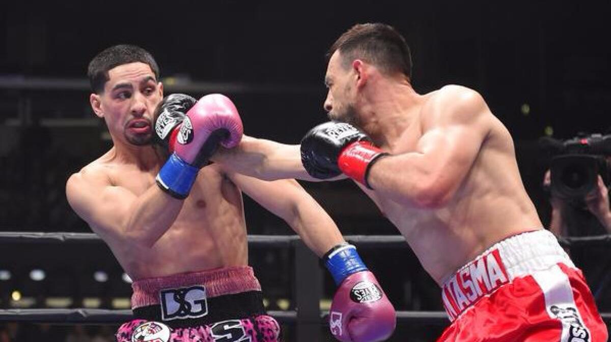 Robert Guerrero throws a right hand at Danny Garcia during a welterweight bout on Jan. 23.