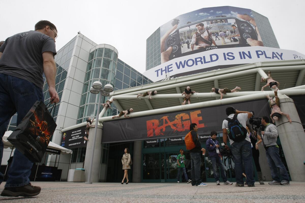 Participants attend the E3 game convention in Los Angeles last year.