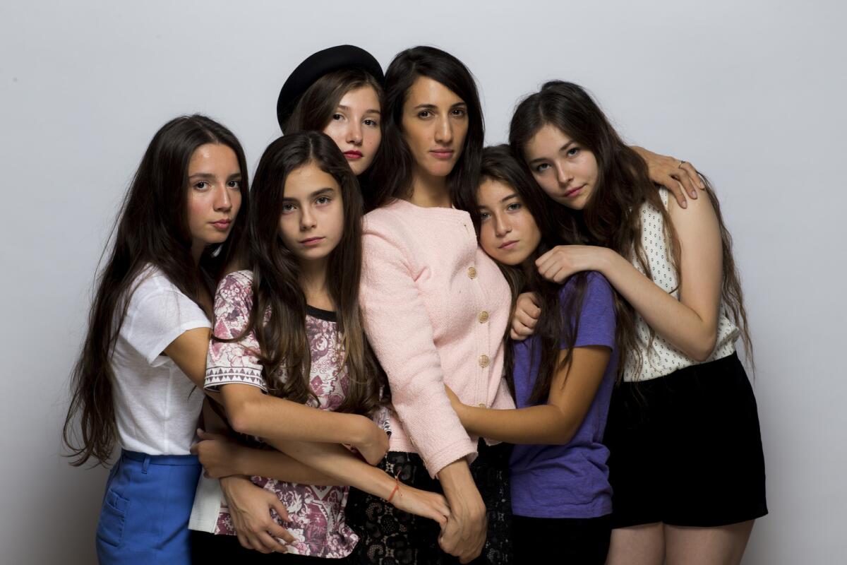 Director and writer Deniz Gamze Ergüven, center, and the cast of "Mustang": from left, Elit Iscan, Günes Sensoy, IIayda Akdogan, Doga Zeynep Doguslu, and Tugba Sunguroglu, are seen in the Los Angeles Times photo studio at the 40th Toronto International Film Festival on Sept. 11, 2015.