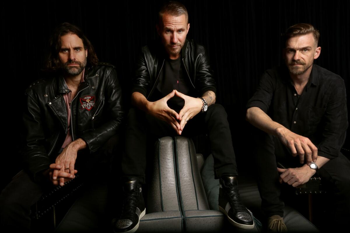 Andrew Wyatt, from left, Christian Karlsson and Pontus Winnberg of the band Miike Snow.