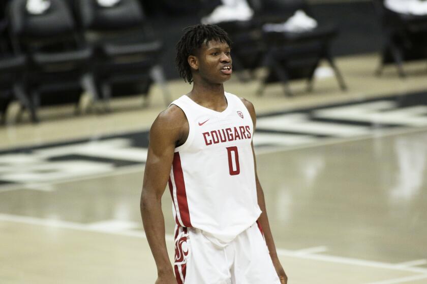 Washington State center Efe Abogidi stands on the court during the second half of an NCAA college basketball game against Oregon State in Pullman, Wash., Wednesday, Dec. 2, 2020. (AP Photo/Young Kwak)