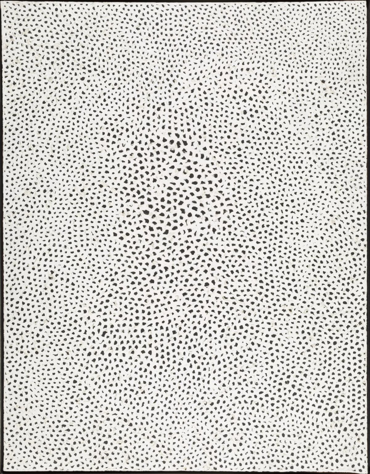 An oil painting of black polka dots on a white canvas.